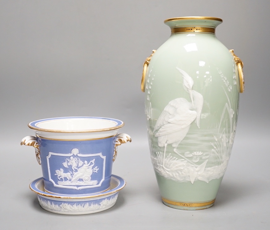 A Royal Worcester pate sur pate 'heron' vase and an early 19th century plant pot and under dish. Tallest 25cm